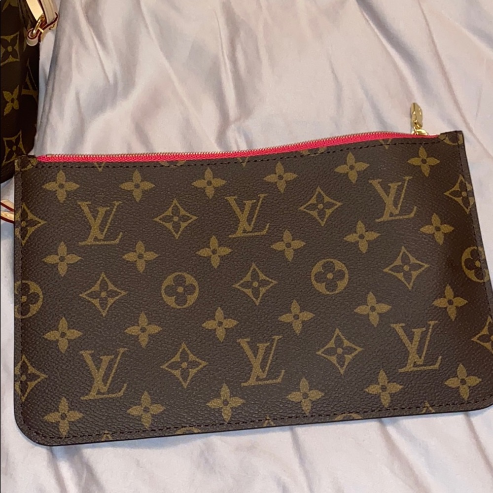 Authentic Louis Vuitton wristlet never worn